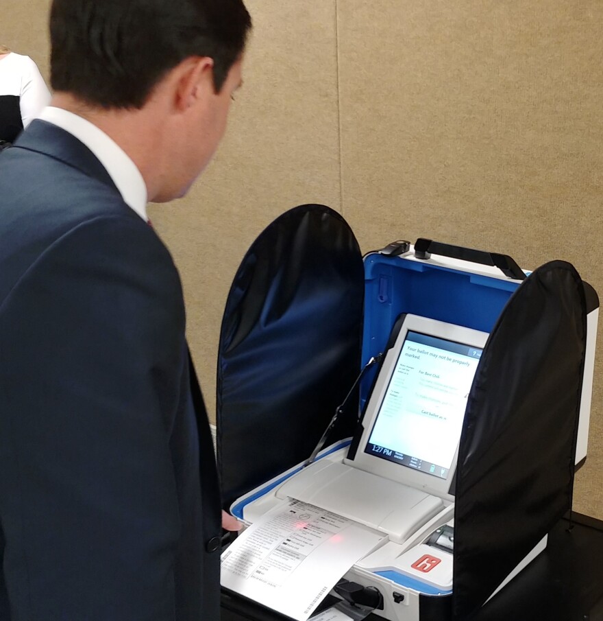 Ohio Secretary of State Frank LaRose tries to confuse the new machine by overvoting on a sample ballot. The machine caught the error.